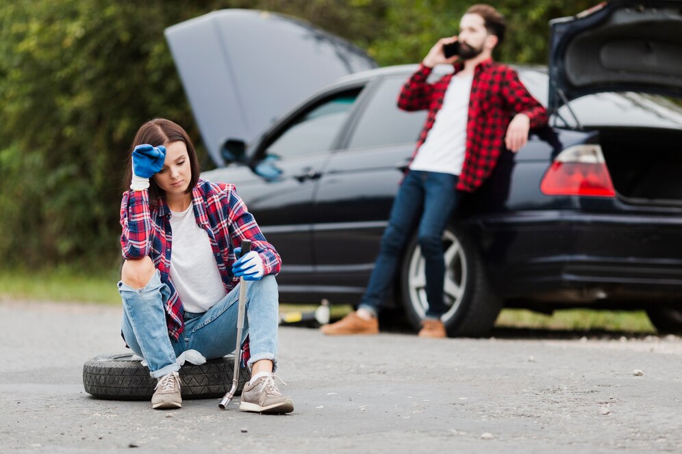 front-view-woman-sitting-tire_23-2148270657 24/7 roadside services washington dc